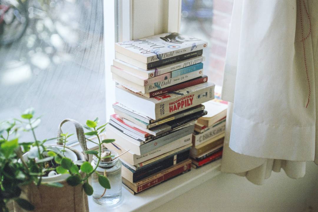 Stack Of Books On A Window Sill